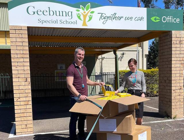 Geebung Special School staff receiving 100 pairs of school shoes