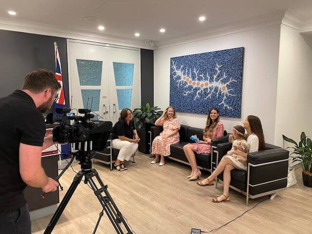Behind the scenes interview with group of women and toddler
